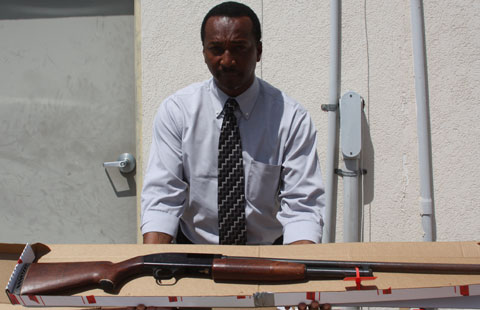 Marlon Bodden with a rifle