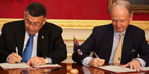 McKeeva Bush signs framework Cayman Islands